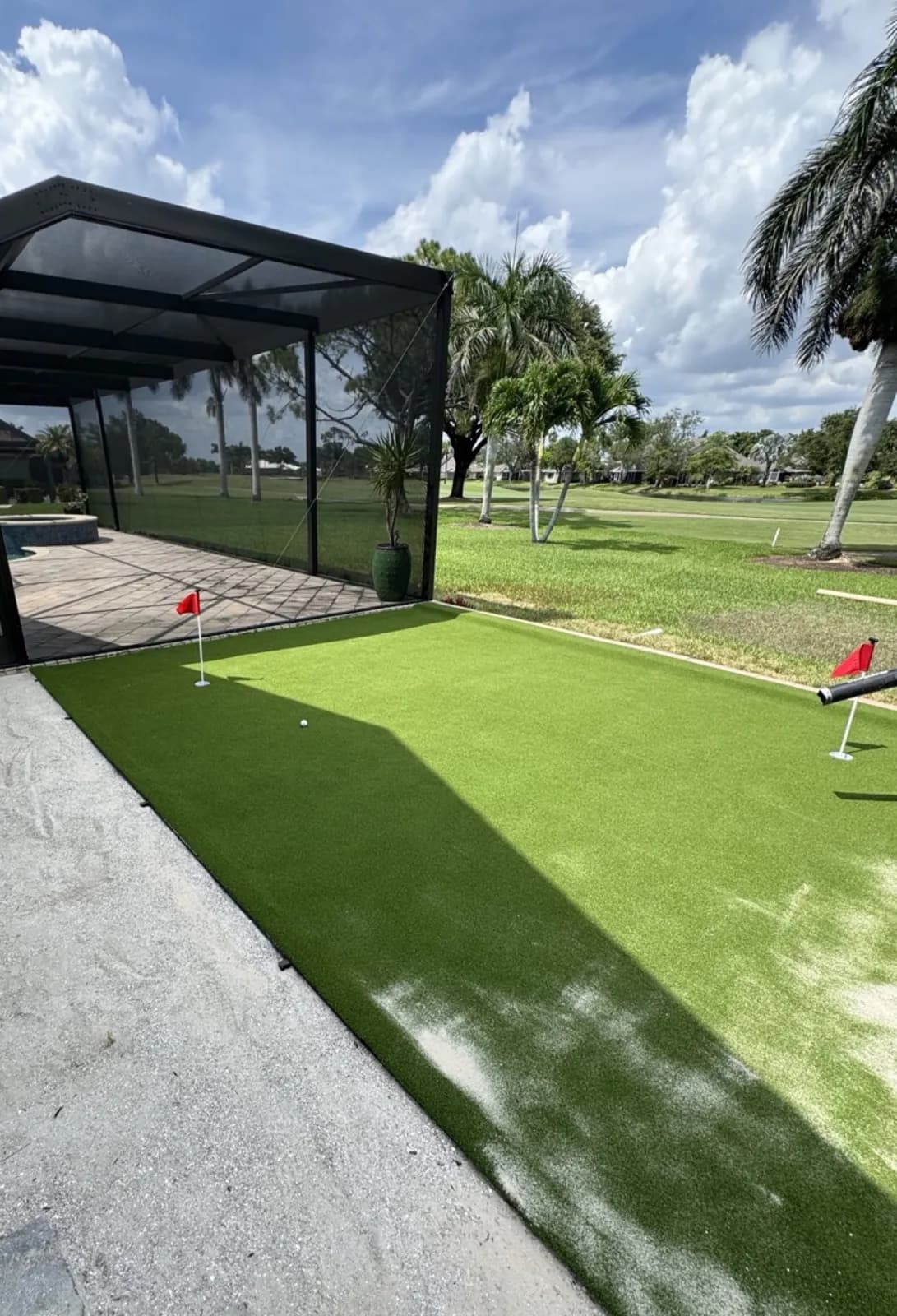 Backyard putting green pool cage, Cape Coral, Florida, by Blue Collar Q